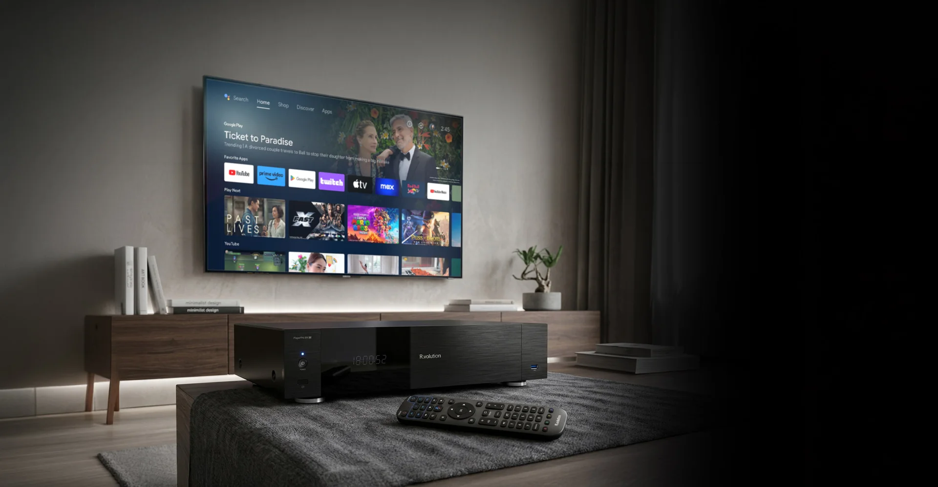 R_volution PlayerPro 8K TV media player and remote in a home cinema setting